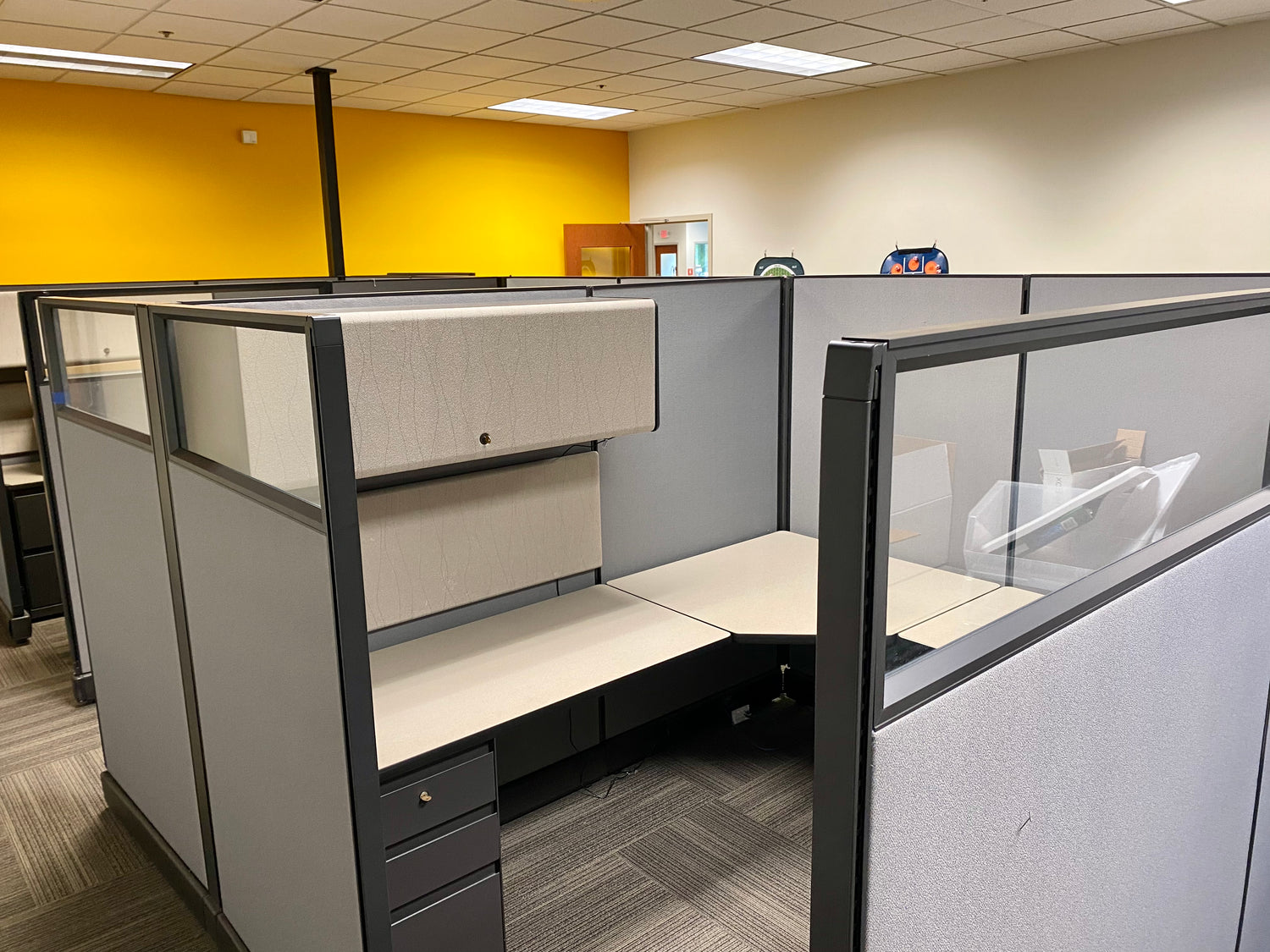 Herman Miller Action Office 2 (AO2) Office Cubicles. Item Highlights: Glass Panels, 2 Filing Drawers, 1 Overhead Bin, Multiple Configuration Options 6x6/6x8, and Ease of Assembly 