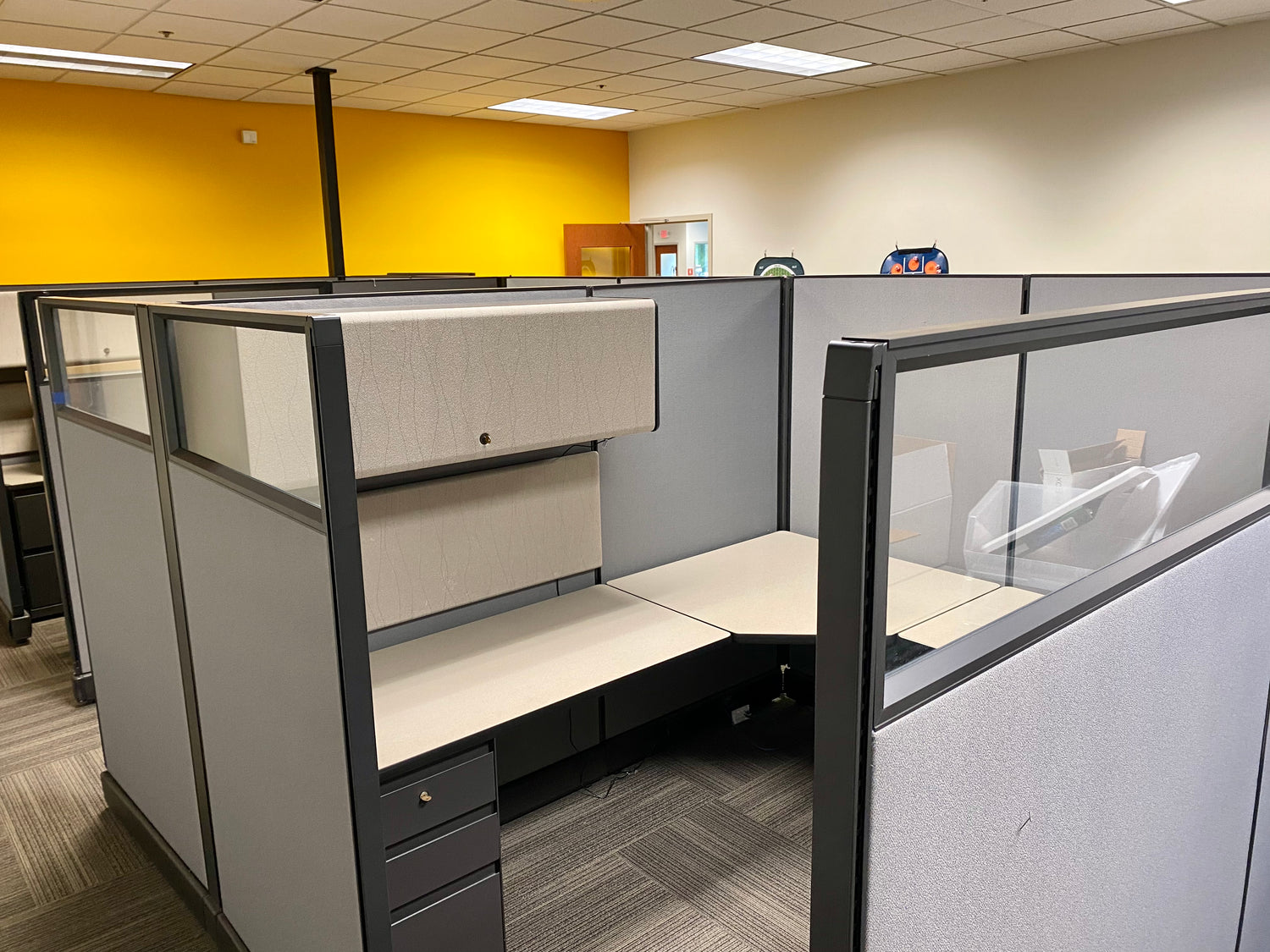 Herman Miller Action Office 2 (AO2) Office Cubicles. Item Highlights: Glass Panels, 2 Filing Drawers, 1 Overhead Bin, Multiple Configuration Options 6x6/6x8, and Ease of Assembly